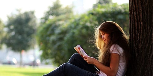 Woman reading pamphlet