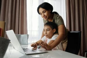 Divorced parent helping child with homework